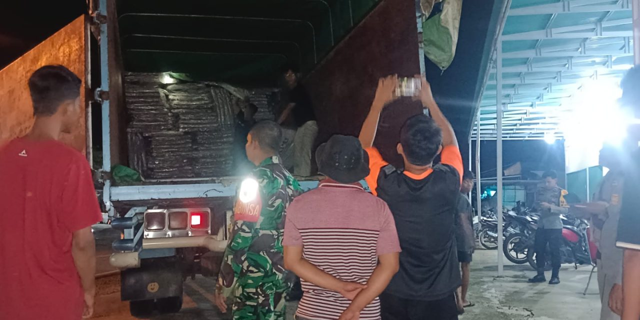 Babinsa Koramil 09/Bangko Kopda Robin Hadiri Penurunan Logistik Pemilu di Gudang KPU Kabupaten Merangin