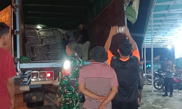 Babinsa Koramil 09/Bangko Kopda Robin Hadiri Penurunan Logistik Pemilu di Gudang KPU Kabupaten Merangin